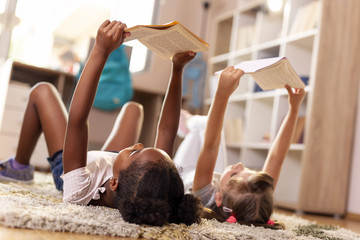 Wall Mural - Little girls reading books