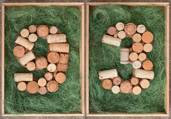 Wall Mural - Number 93 ninety three made of wine corks on green background in wooden box