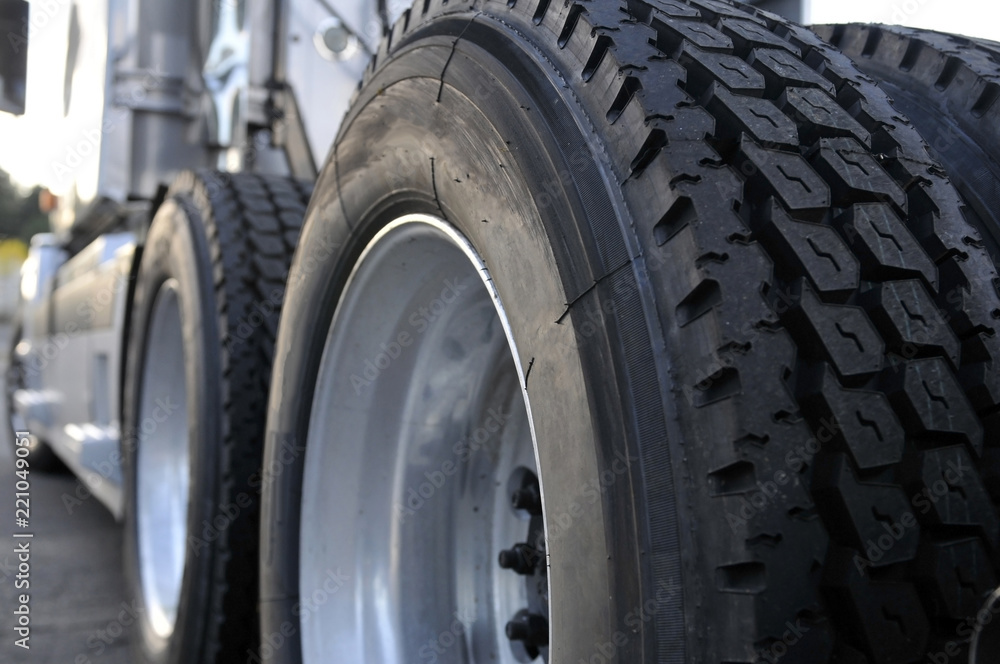 Big rig semi truck with huge wheels with tires Stock Photo | Adobe Stock