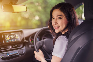 Wall Mural - happy young woman in car