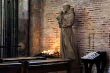 Saint Anthony Of Padua Holding Baby Jesus Statue In Saint Sernin Church, Toulouse, France. It Is A Church Destination Of Pilgrimage On The Way To Santiago Of Compostela