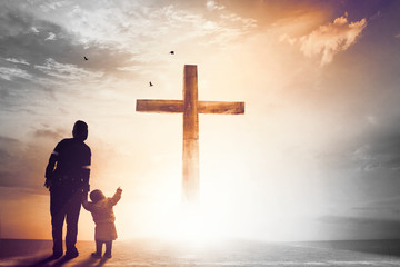 Wall Mural - praise and worship concept:silhouette of christian prayers raising hand while praying to the jesus