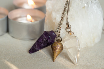 Three pendulum and candle lights