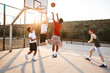 © Drobot Dean - Group of young sporty multiethnic men basketball players