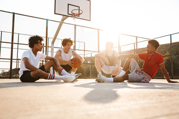 Wall Mural - Group of young smiling multiethnic men