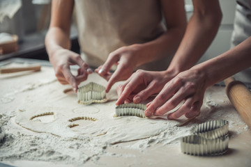 Wall Mural - Mom and daughter baking