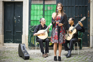 Wall Mural - Fado band performing traditional portuguese music in Alfama, Lisbon, Portugal