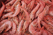 Top view of raw shrimps in market, texture background, selective focus