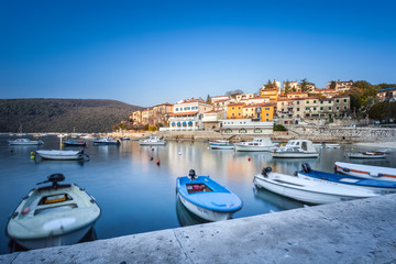 LABIN / CROATIA - MARCH 01, 2012: Long exposure shot of croatian bay in Labin city taken at dawn at blue hour