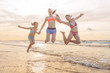 © bubutu - Kids having fun at sunset beach - friendship freedom beach summer holiday concept