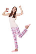 © 5second - Young girl in pajamas with red alarm clock on white background