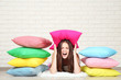 © 5second - Young girl with colorful pillows lying on floor