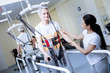 © Viacheslav Yakobchuk - Convenient construction. Optimistic aged disabled patient looking glad while wearing a special helpful body vest with a cheerful attentive worker of a rehabilitation center holding his hand