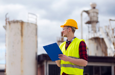 Wall Mural - Photo of male engineer or inspector near industrial zone