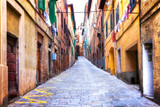 Fototapeta Uliczki - Traditional Italy - old narrow streets of medieval town Siena in Tuscany