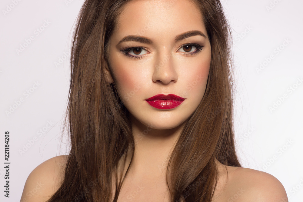 Close up portrait of a beautiful young female face with red lips and ...