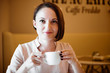 © soleg - portrait of a young woman in a cafe