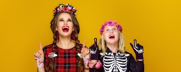 Sticker - mother and daughter in halloween costume pointing at something