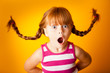 © IdeaBug, Inc. - Surprised Little Girl with Pigtails, Gasping