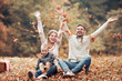 © ivanko80 - Happy family having fun in autumn forest