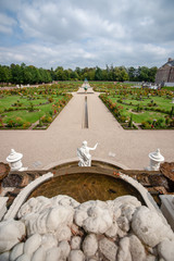 View over a baroque landscaped garden from a marble fountain with a perspective