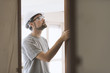 Carpenter installing a door jamb at home