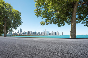 asphalt highway through garden with skyline