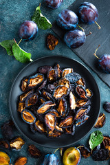 Canvas Print - Dried prune and fresh plums with leaves