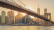 The panorama view of Brooklyn Bridge with Lower Manhattan at sunset