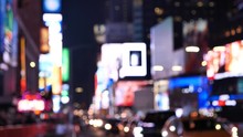 Times Square At Night Out Of Focus Traffic, Billboard And Lights, New York City