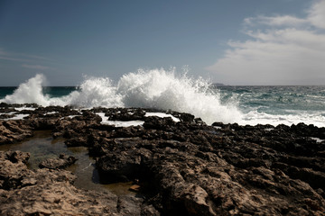 Wall Mural - Waves on the stone coast