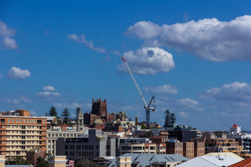 tower crane on the construction building in the city with blue sky background.