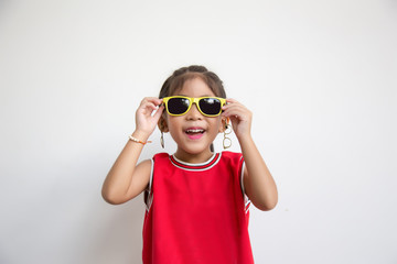 Wall Mural - asian kid with sport shirt and sun glasses fashion