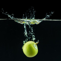 Wall Mural - Green apple under water