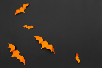 Wall Mural - halloween and decoration concept - paper bats flying