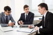 © chagin - Businessmen working in an office
