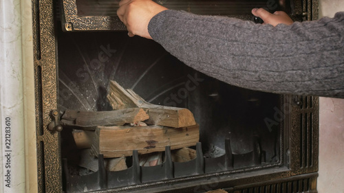 Closeup Image Of Man In Sweater Opening Fireplace Glass Door Buy