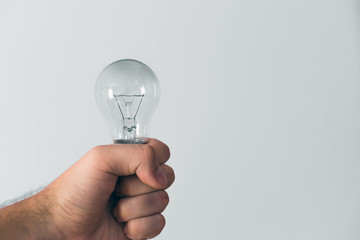 Bulb in hand, concept of idea