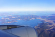 Scenery from airplane's window viewing blue sky , South Korean Peninsula , adjacent islands and Busan Metropolitan City in the morning , South Korea