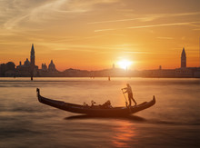 Gondola And The Sunset In Venice Italy