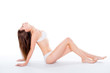 © deagreez - Portrait of sensual tender woman sitting over white background i