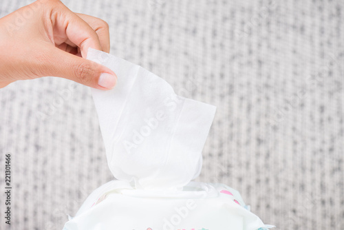Closeup woman hand holding wet wipes from package Tableau sur Toile