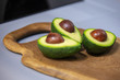 Sliced Avocado on a wooden Board in a modern kitchen 