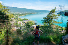 Hiker Woman Looking At Lake Of Annecy In French Alps