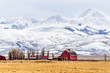 Montana Farm Below Massive Snow Covered Mountains