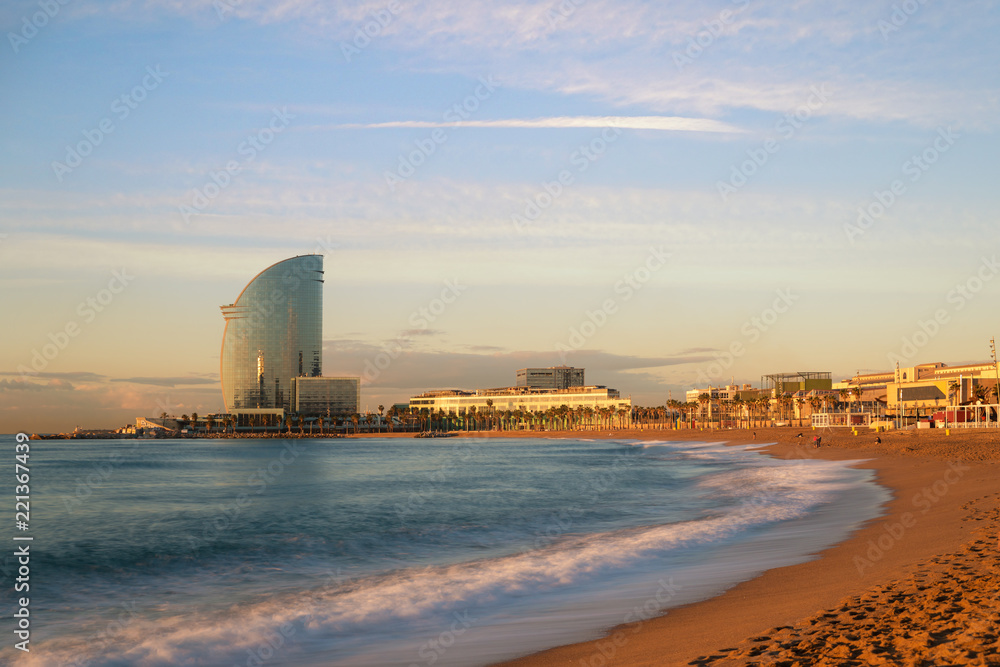 Obraz na płótnie Barceloneta Beach in Barcelona with colorful sky at sunrise. Seafront, beach,coast in Spain. Suburb of Barcelona, Catalonia w salonie