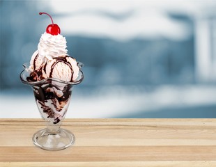 Canvas Print - Delicious ice cream dessert with whipped cream and cherry