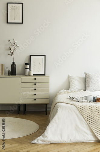 A Monochromatic Beige And White Bedroom Interior With A View