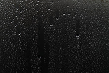 Black Wet Background / Raindrops For Overlaying On Window, Concept Of Autumn Weather, Background Of Drops Of Water Rain On Glass Transparent