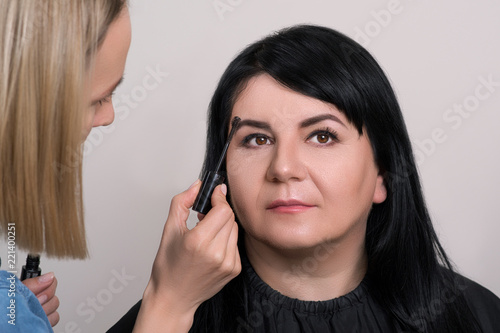 500px x 334px - Eyebrow care. Beautiful mature woman at beauty salon. Makeup ...